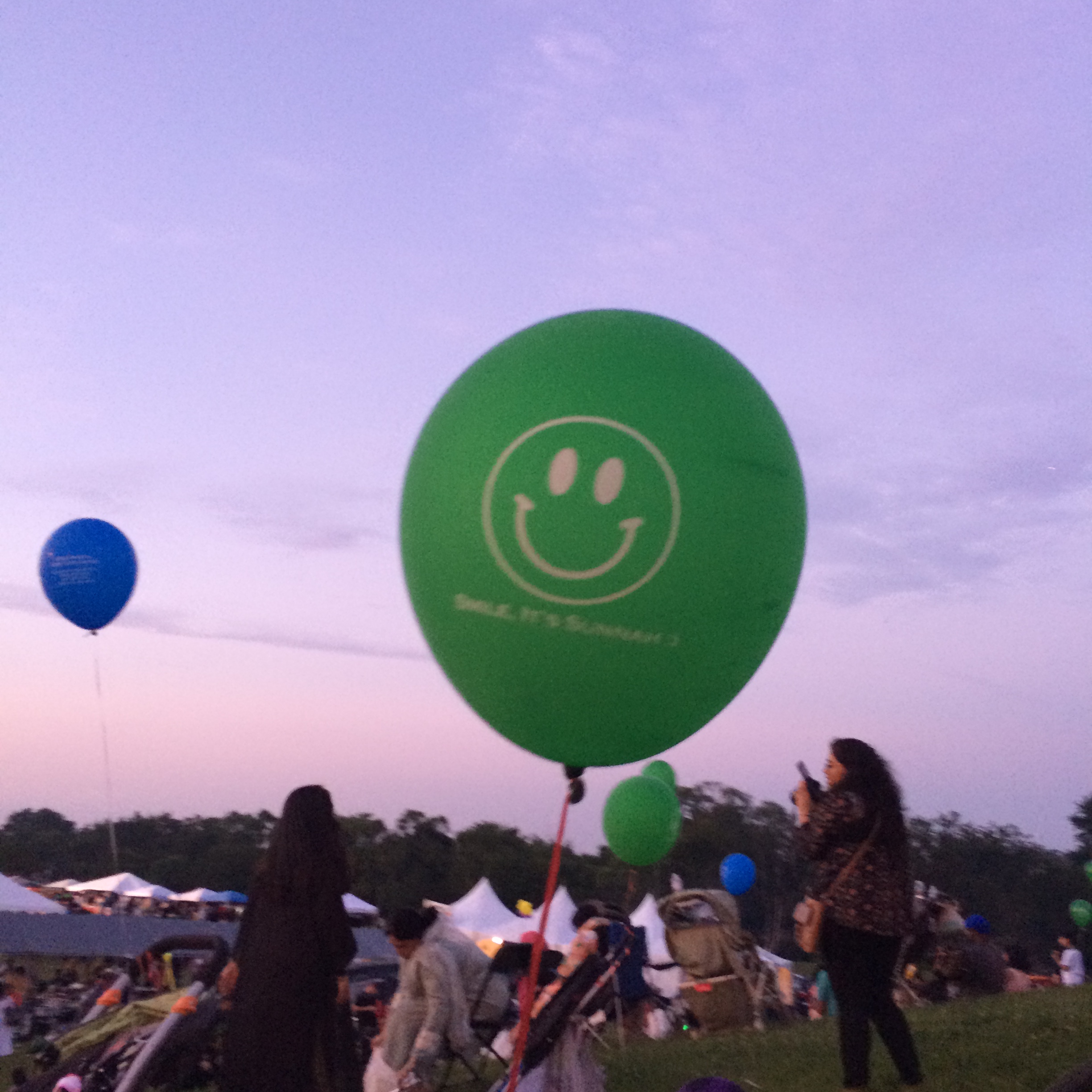 The balloon says "smile, its sunnah." Sunnah refers to the sayings and actions of the Islamic prophet Muhammad (peace be upon him). 